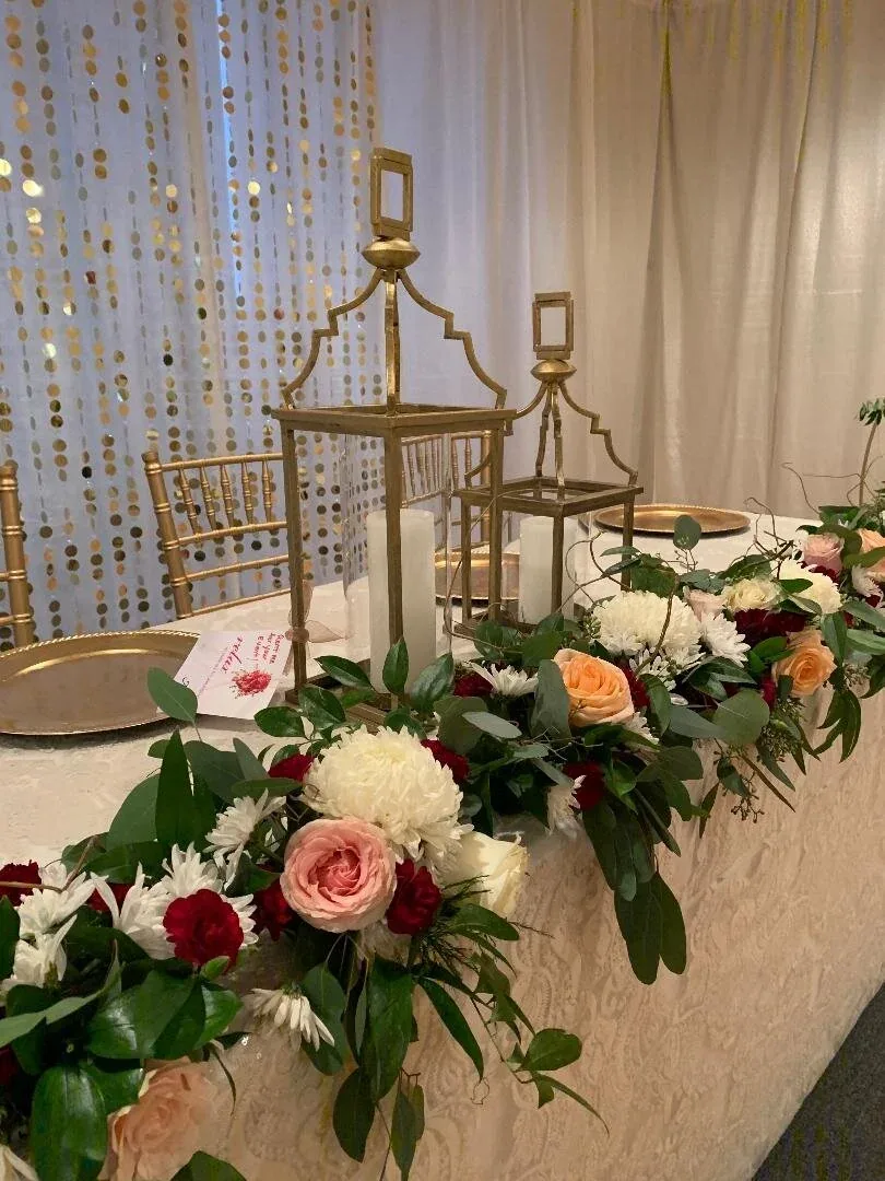 Tall reception centerpiece on a gold stand