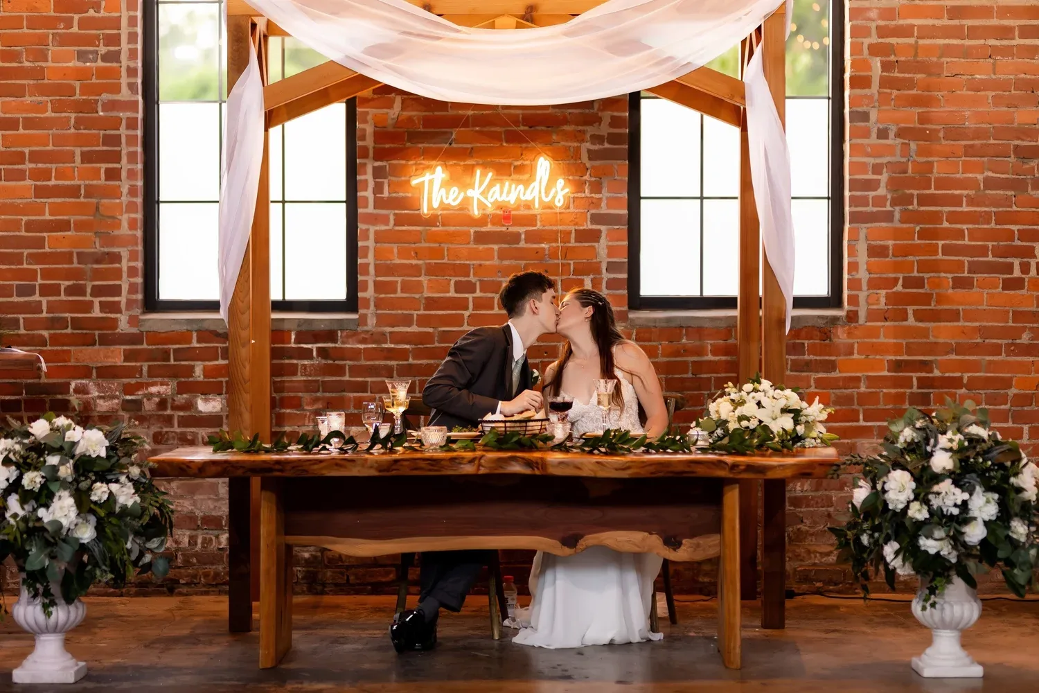 Sweetheart table greenery installation